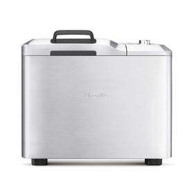 Breville BBM800XL front-angle view highlights space-saving stainless steel design for home baking.