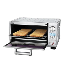 Breville BOV450XL inside cavity with crumb tray highlights easy cleanup after baking.