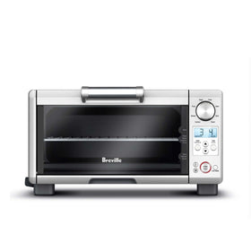 Breville BOV450XL mini smart oven front view showing compact countertop efficiency.