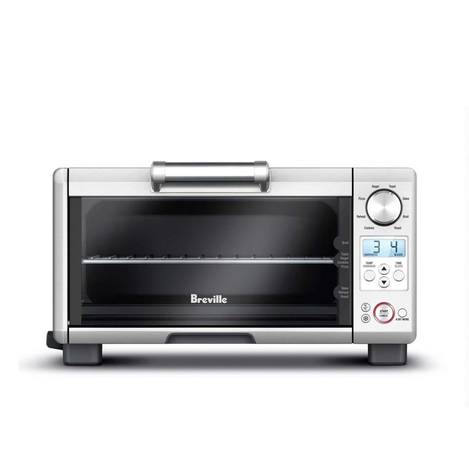 Breville BOV450XL mini smart oven front view showing compact countertop efficiency.