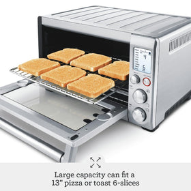 Breville BOV800XL cooking a 13-inch pizza with crisp edges