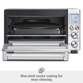 Breville includes rack, baking pan, broiling rack, and pizza pan with the oven.