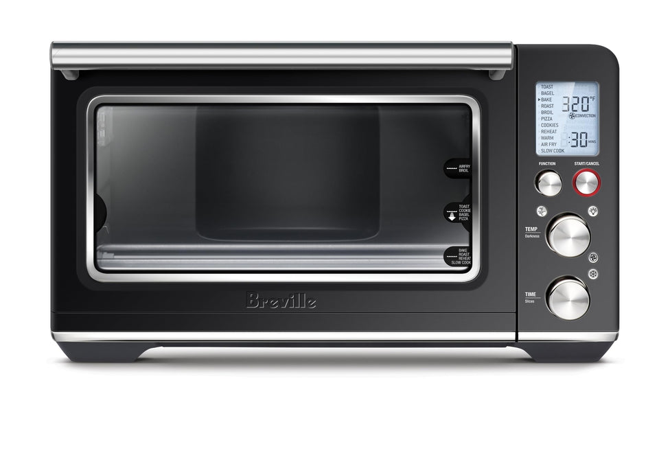 Breville BOV860BTR interior with air fry basket for crisp results.