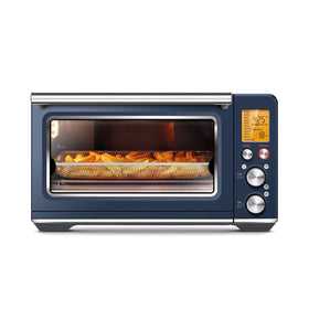 Breville BOV860DBL front view on a modern kitchen counter, compact countertop versatility.