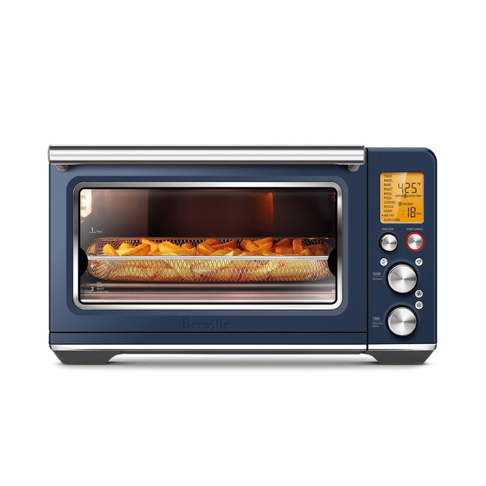 Breville BOV860DBL front view on a modern kitchen counter, compact countertop versatility.