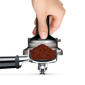Breville Dosing Funnel on portafilter supports quick tamping.