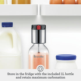 Breville InFizz pouring carbonated beverage with precision and control.