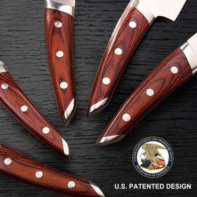 Brewin Chefilosophi ergonomic red pakkawood handle close-up for a secure grip during extended prep.