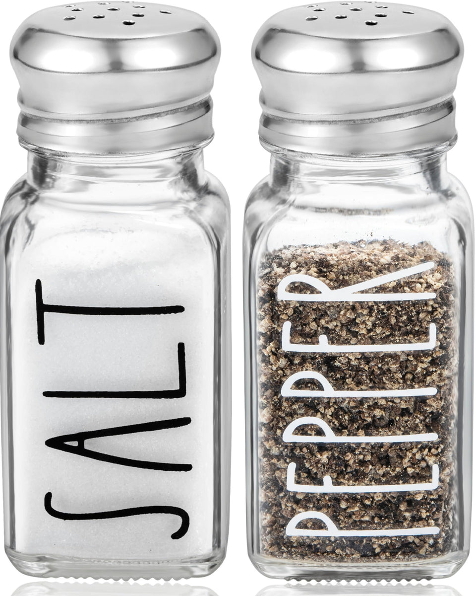 Brighter Barns clear glass salt shaker front view with stainless lid for precise seasoning.