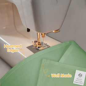 BRILLMAX sage green tablecloth spill-beading resists liquids for quick cleanup.