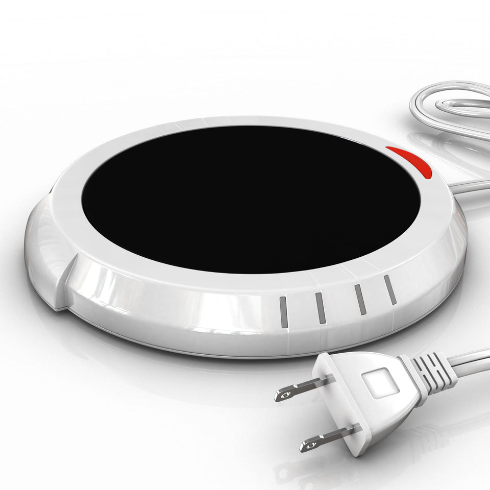 Bulk Paradise candle warmer plate on a desk releases scent safely without flame.