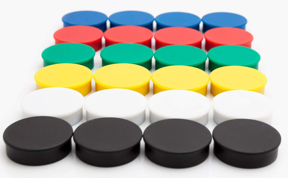 Bullseye Office magnets in vibrant colors on a fridge holding notes and papers