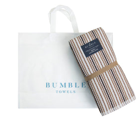 Bumble Towels care tips closeup, machine washable and durable through many washes.