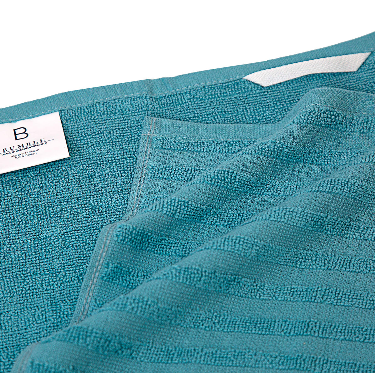 Bumble Towels flat towel on counter for drying tasks in the kitchen.