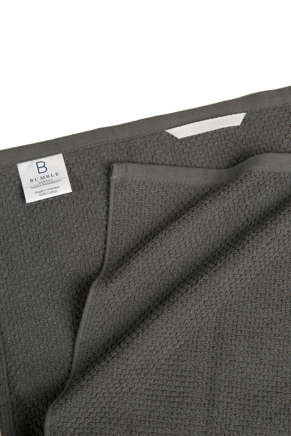 Bumble Towels towels with hanging loop for easy drying and storage.
