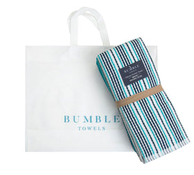 Bumble Towels packaging includes a signature tote bag for gifting or travel.