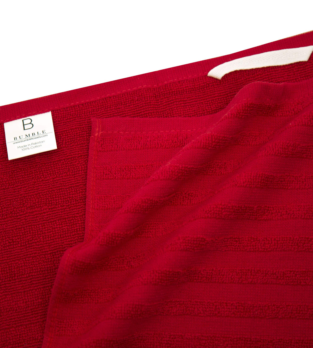 Bumble Towels hanging loop photo shows easy air-drying and storage.