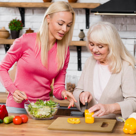 Busy Gaming Life board used for cutting fruits and vegetables during prep.