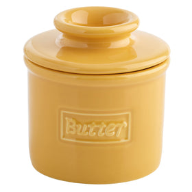 Butter Bell Original Crock in golden-yellow glaze keeps butter ready for easy spreading.