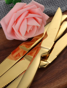Buyer Star steak knives on table with steak demonstrate effortless cutting