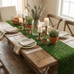 BYHER table setting with moss runner showcases natural evergreen ambiance