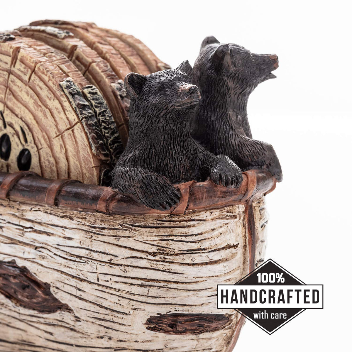 Bear coasters with canoe scene add charm to coffee table in lodge settings