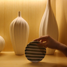 CACXKEP mug and saucer displayed on wall cabinet, stylish and accessible