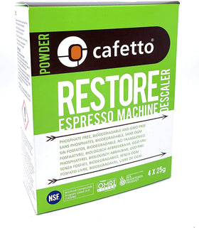 Cafetto Restore descaler 4-pack packets beside a clean espresso machine.