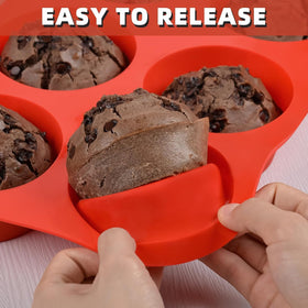 CAKETIME jumbo muffin pan on baking tray demonstrates stable support while filling.