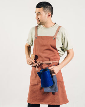 Caldo Crossback apron two pockets keeps tools close for efficient cooking and service.