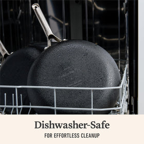 Calphalon frying pan handle closeup shows stay-cool stainless steel grip.