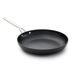 Calphalon hard-anodized 12-inch frying pan on stovetop with even heating for consistent searing.