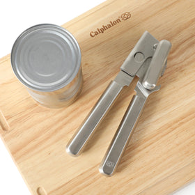 Calphalon Prime bottle opener in use demonstrates easy leverage and secure grip.