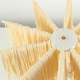 Cambom white pasta rack with 10 bar handles for organized drying.
