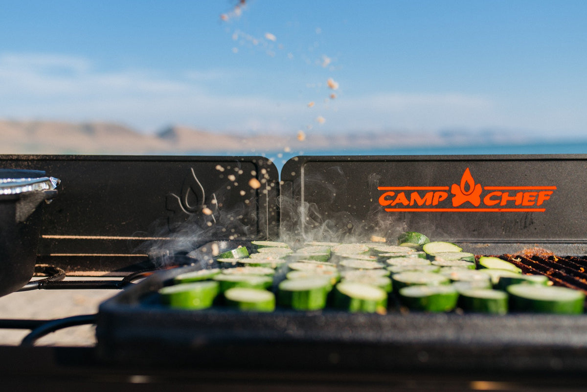 Camp Chef cast iron griddle 16x24, ribbed side creates sear marks on burgers and more.