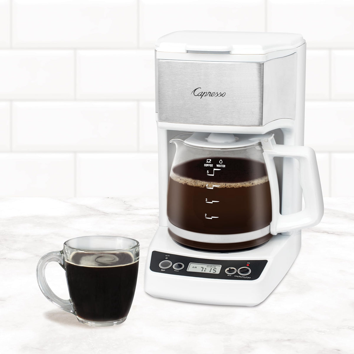 Capresso white drip-stop feature allows pouring a cup while brewing