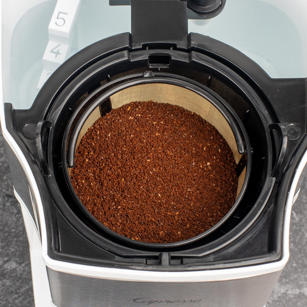 Capresso white finish complements compact counters and modern kitchens