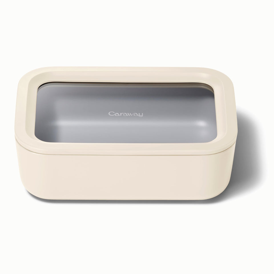 Caraway 6.6 cup glass storage container with a clear lid for easy meal planning.