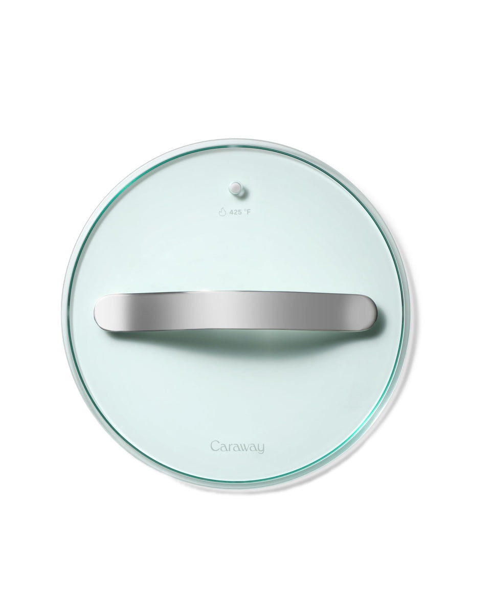 Caraway 8-inch glass lid fits pots and pans for crystal-clear cooking view.