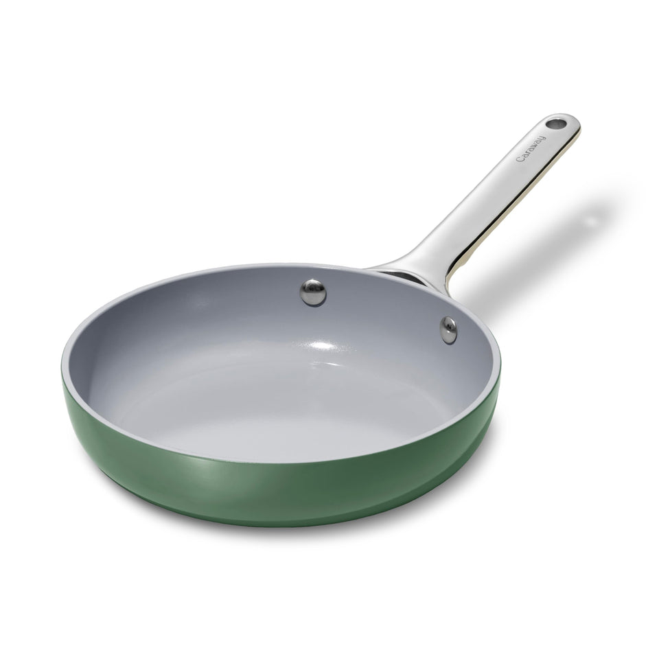 Caraway mini fry pan 8-inch sage with smooth ceramic surface for easy release.