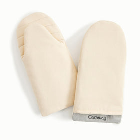 Caraway oven mitts in cream with a double-layer design for safer grip.