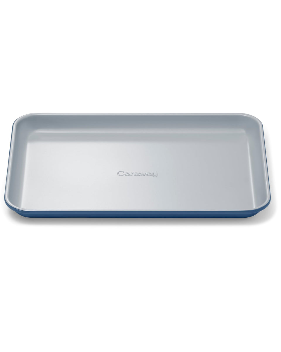 Caraway small baking sheet 9x13 navy with nonstick ceramic coating for easy baking.