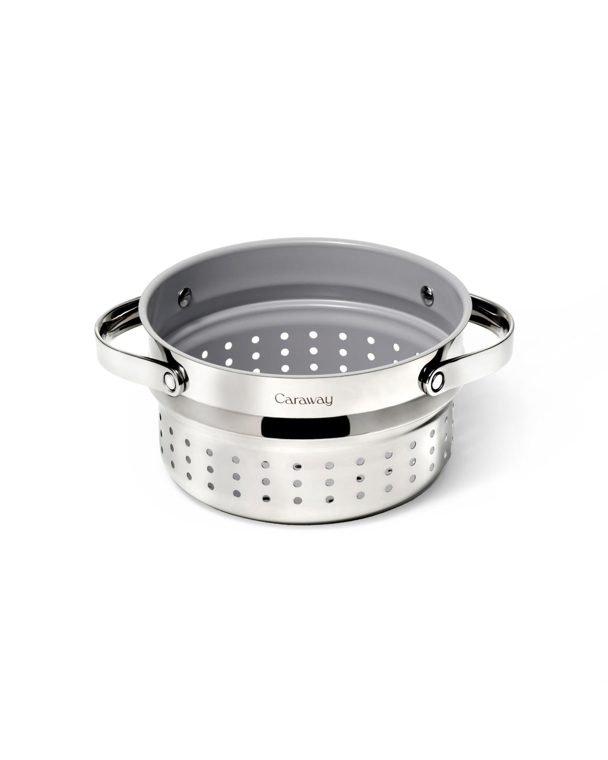 Caraway Steamer Small stainless steel basket inside a pot for vegetables.