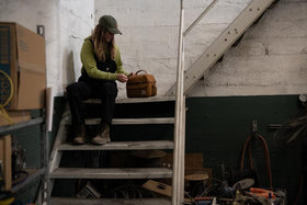 Carhartt lunch box in Greenstone highlighting Rain Defender durability on polyester