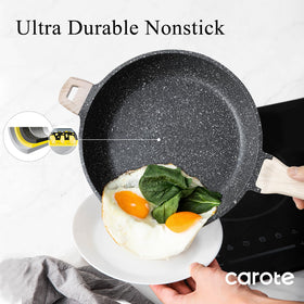 Carote nonstick pan being wiped clean after cooking