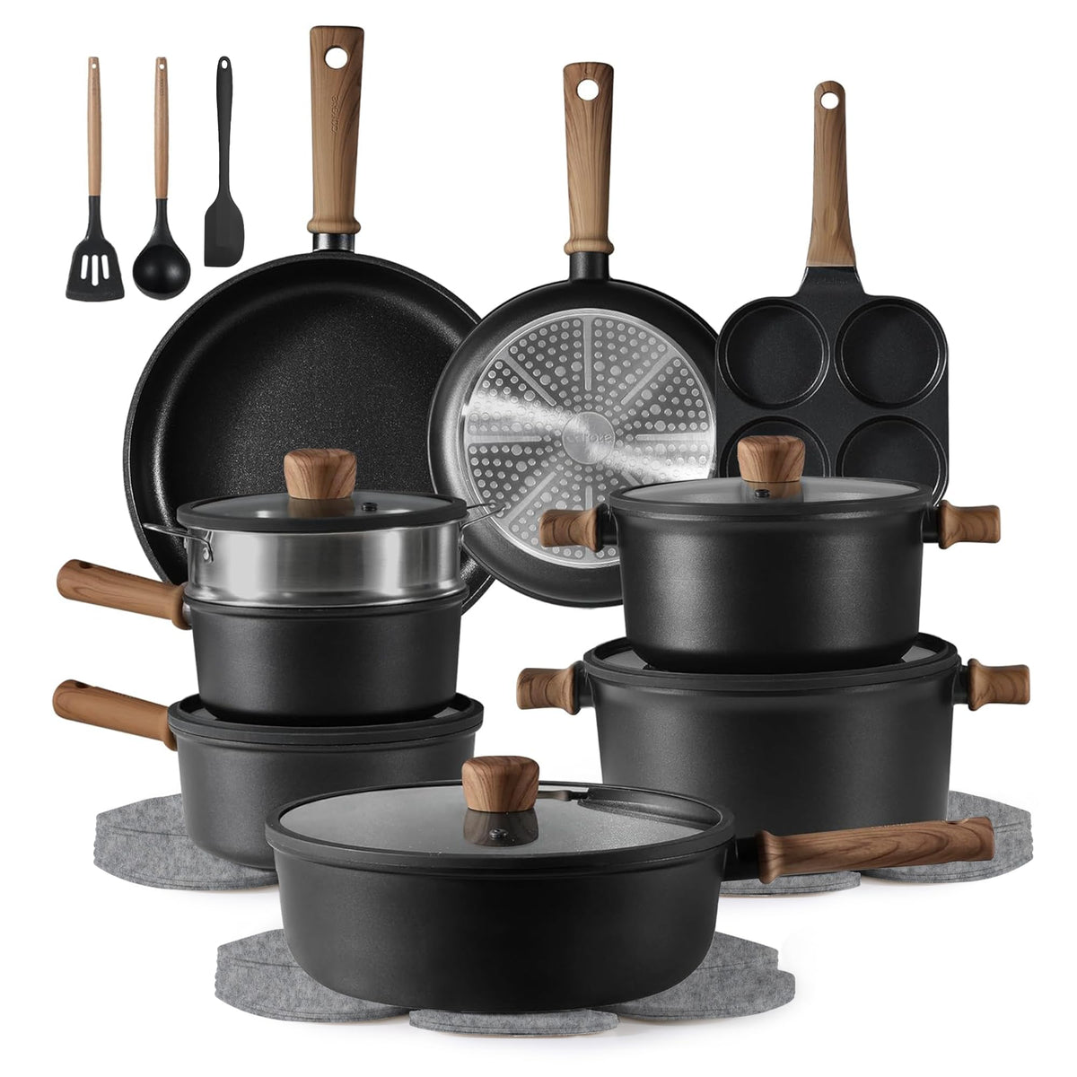 CAROTE 24pcs nonstick titanium cookware set on stove for quick meal prep.