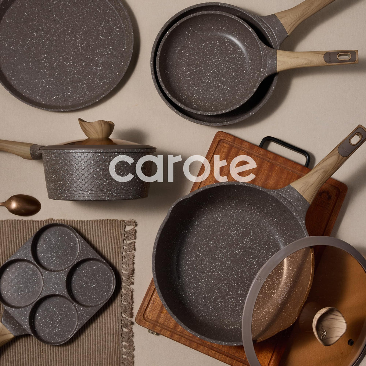 CAROTE pan protectors included for organized storage and surface protection.
