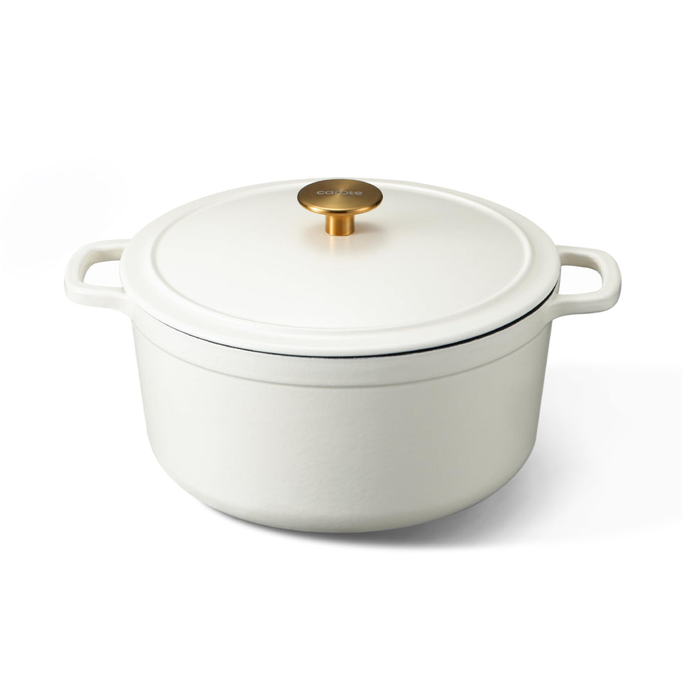 Carote 5qt enameled dutch oven in cream white with lid on, ideal for braises.
