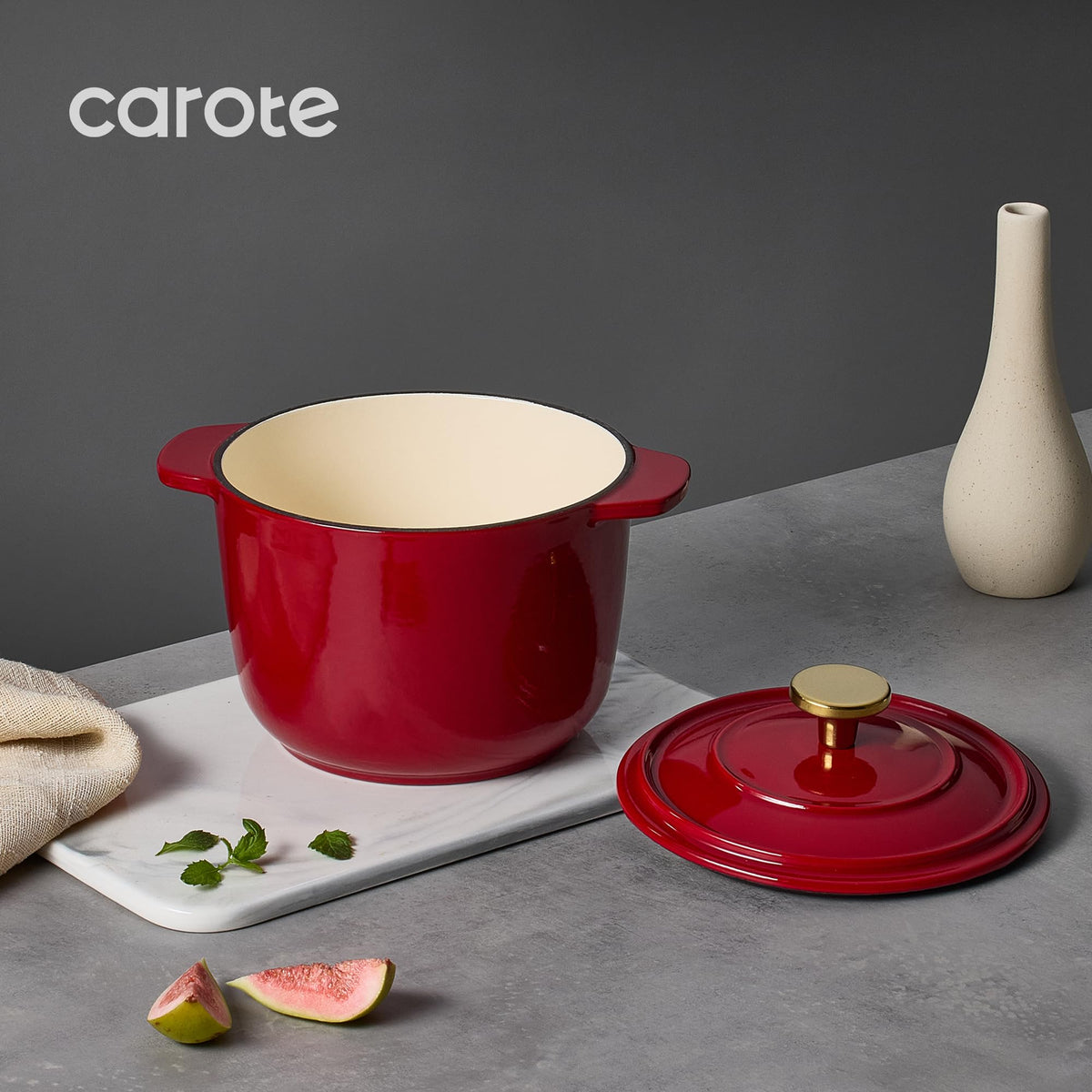 CAROTE enameled cast iron red pot with double handles for safe lifting.