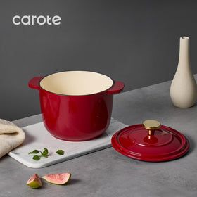 CAROTE enameled cast iron red pot with double handles for safe lifting.